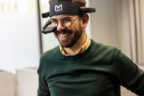 A man using smart glasses